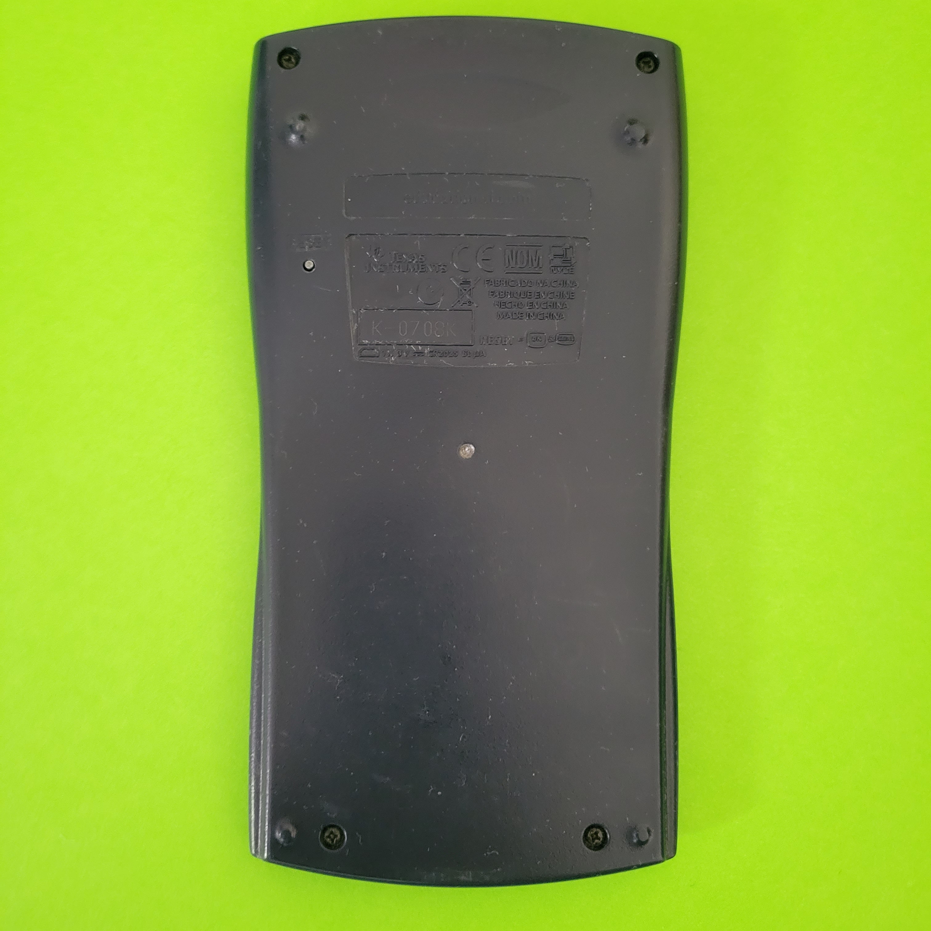 An image of the back of a texas instruments ti-30xiis scientific engineering calculator
